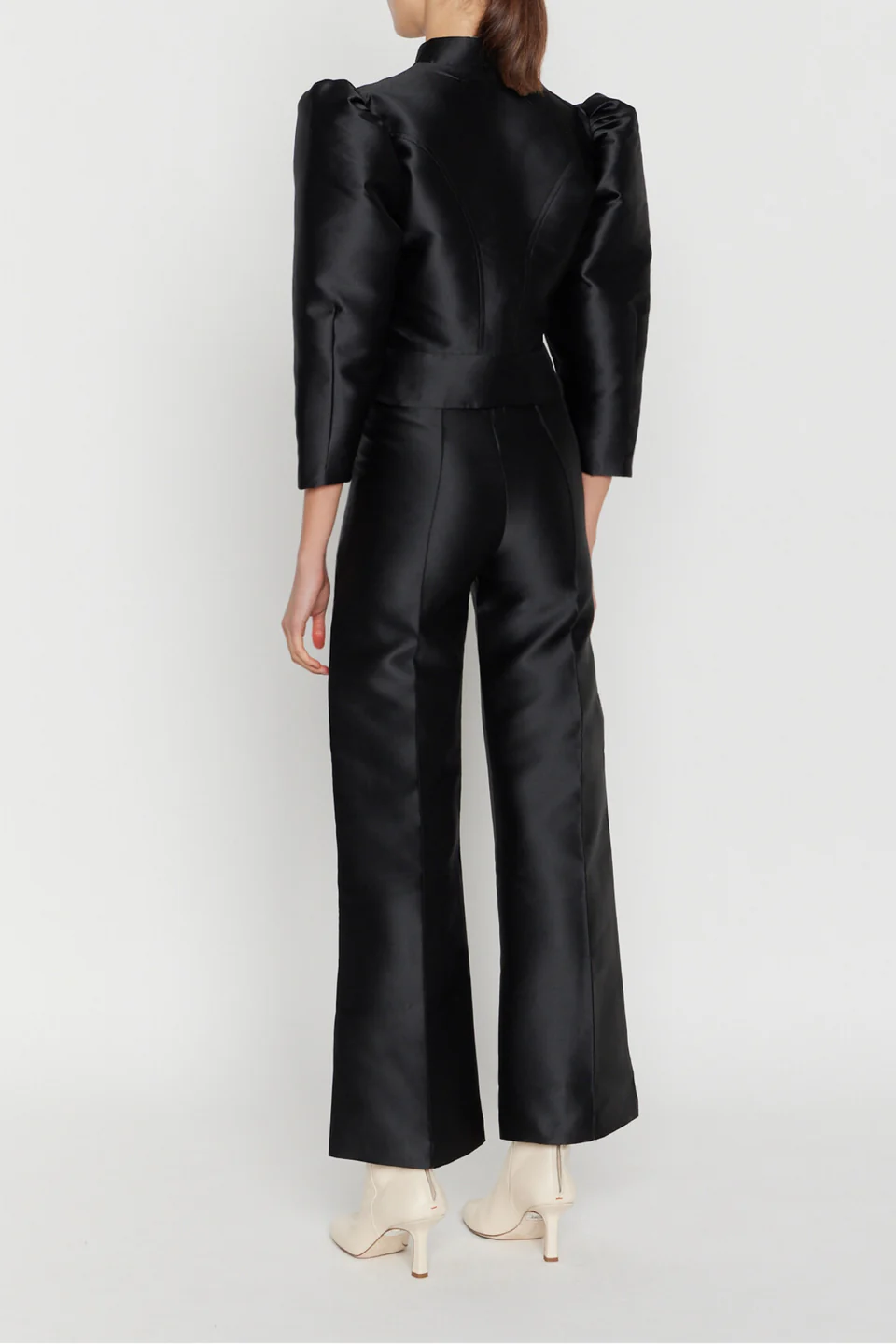 Destree black high-waisted flare pants with a cropped length, offering a sleek, modern silhouette.