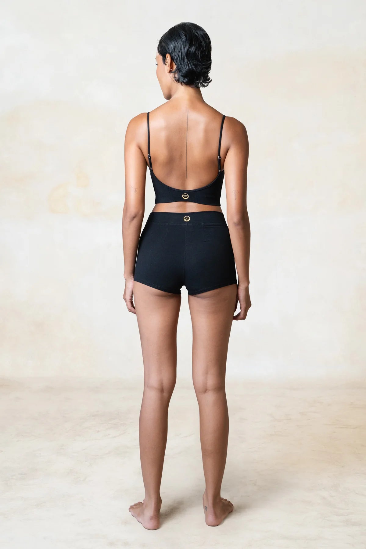 Eco-friendly black top made from organic bamboo, designed for yoga and movement.