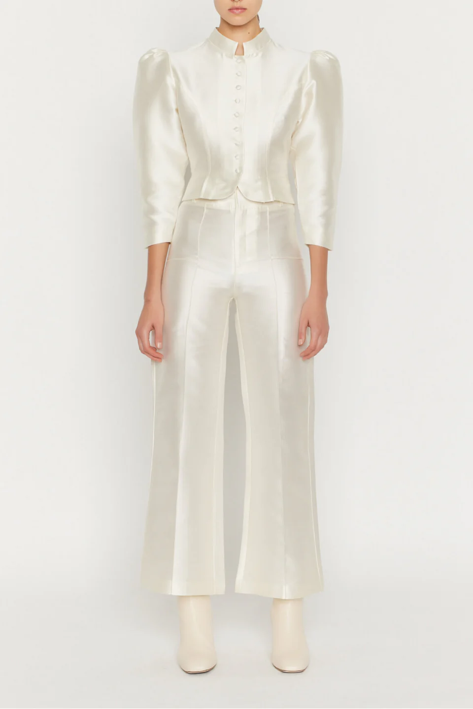 Elegant off-white high-waisted trousers by Destree, designed with a straight flared cut and concealed zip closure.