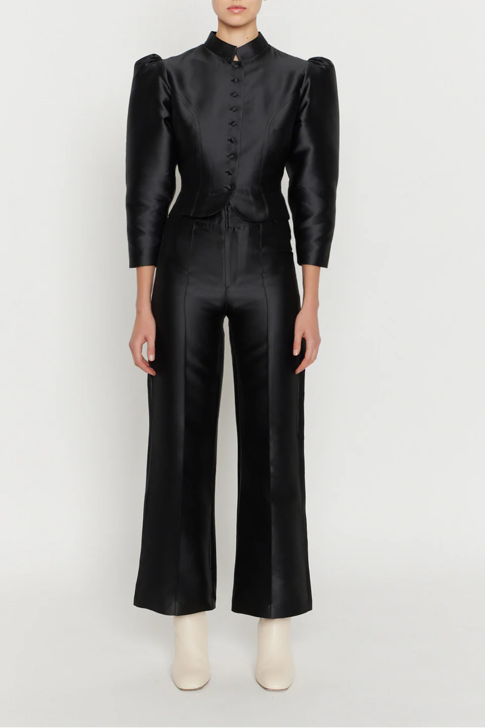 Chic black flare pants from Destree with a body-hugging fit, pressed front crease, and a polished finish.