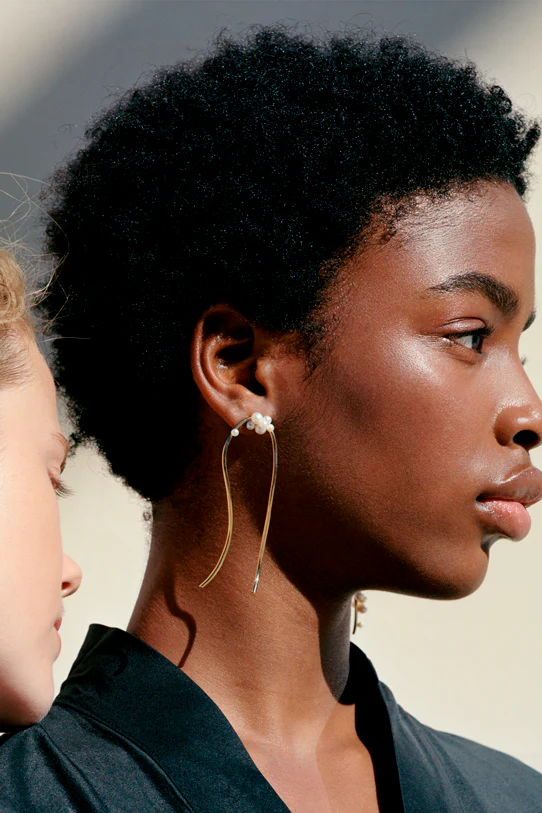 Completedworks earrings featuring cascading freshwater pearls for an elegant, expressive design.