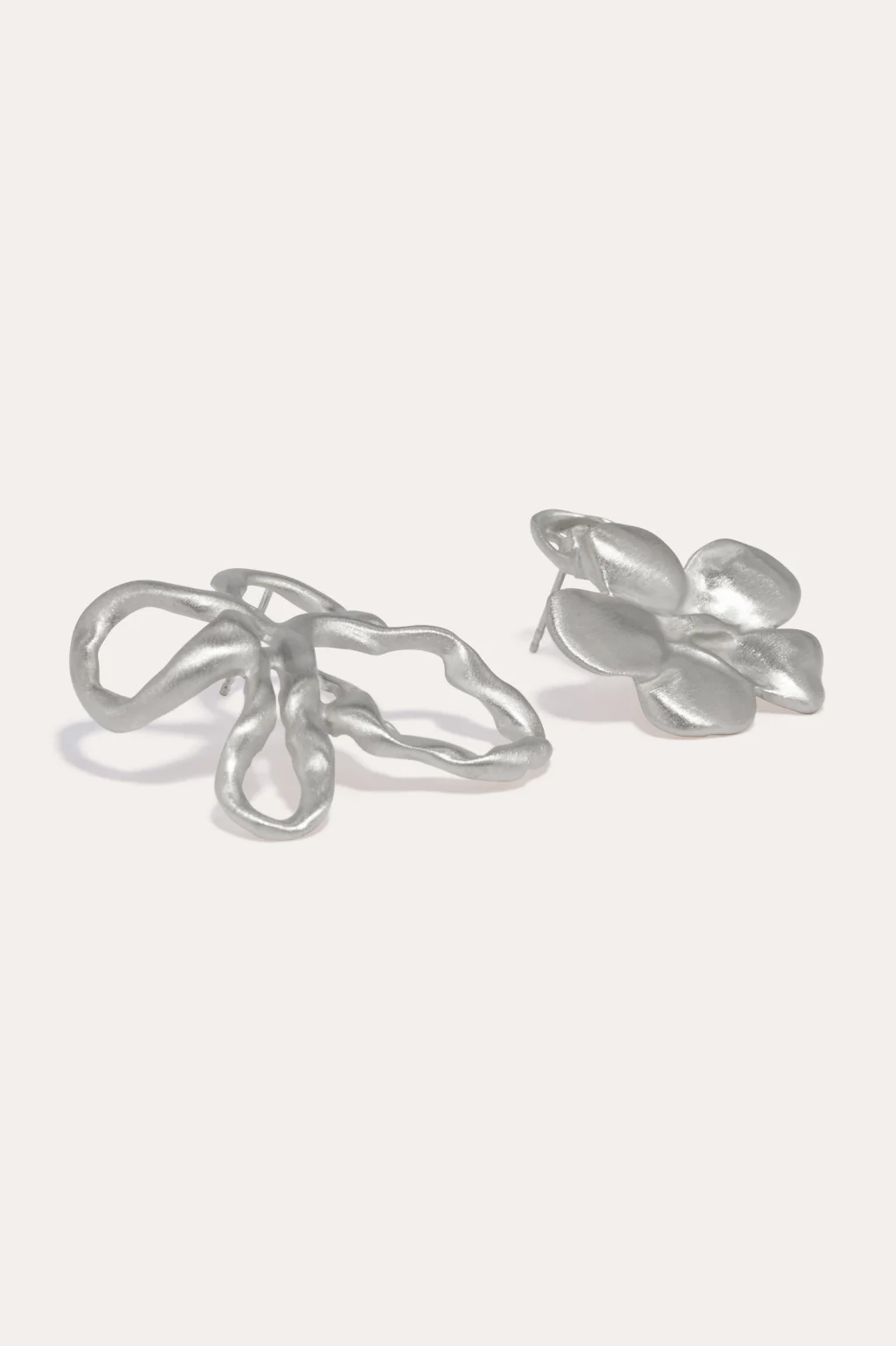 Asymmetrical flower earrings crafted by Completedworks, featuring a delicate and artistic design.
