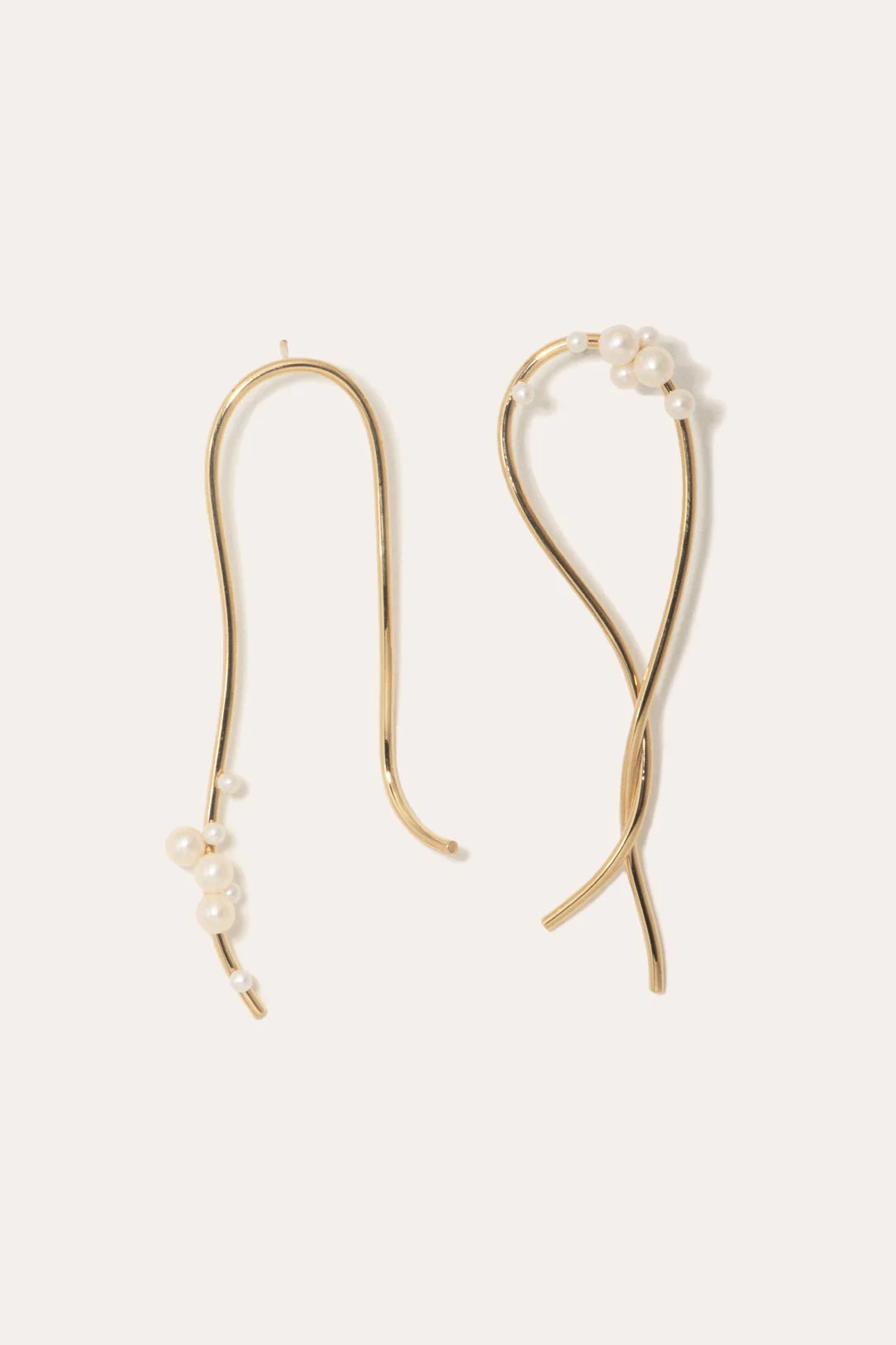Statement earrings with cascading freshwater pearls, offering a playful yet sophisticated look.