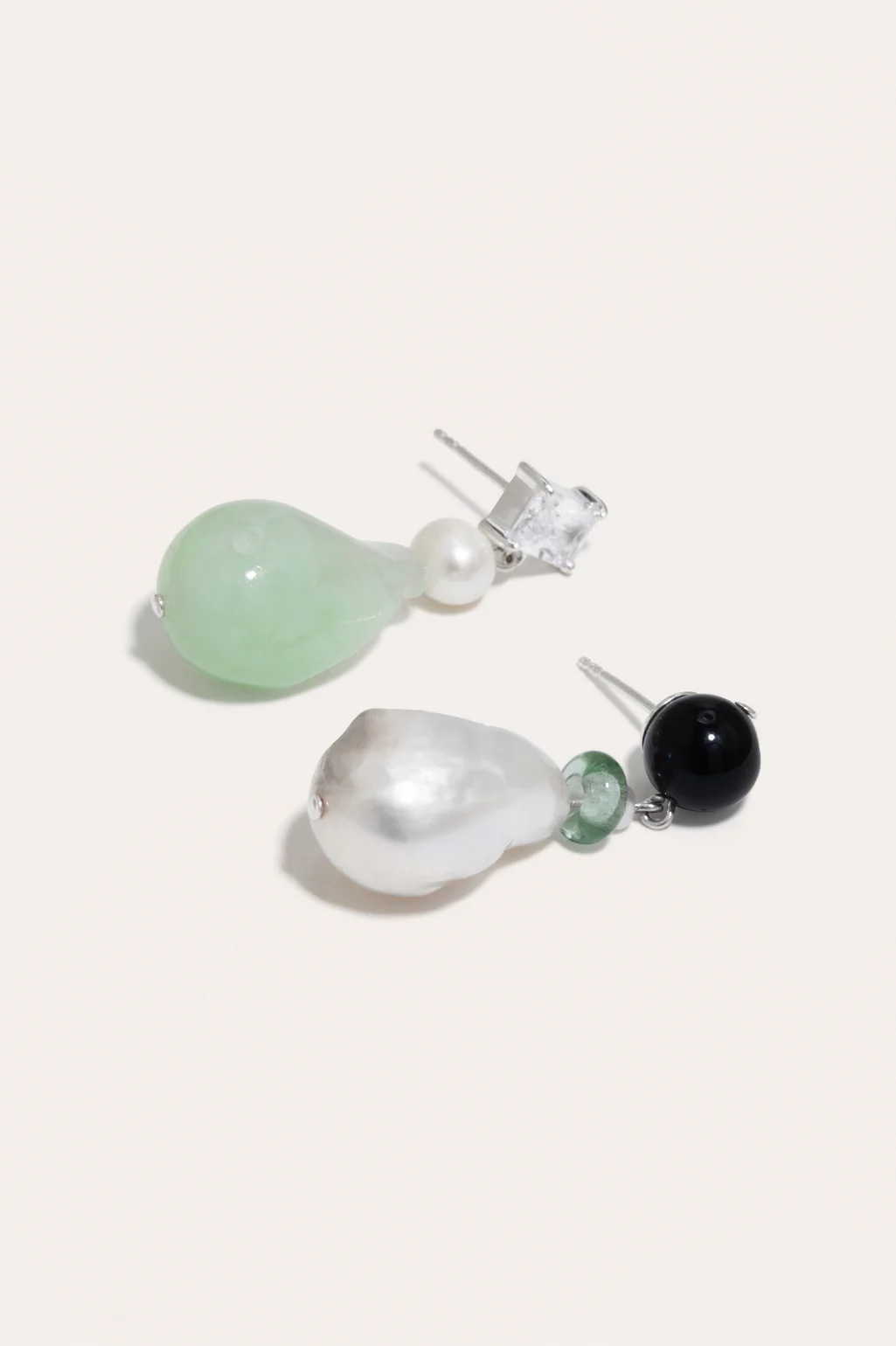 Completedworks recycled sterling silver earrings featuring baroque pearls, onyx, and recycled glass for a sustainable design.