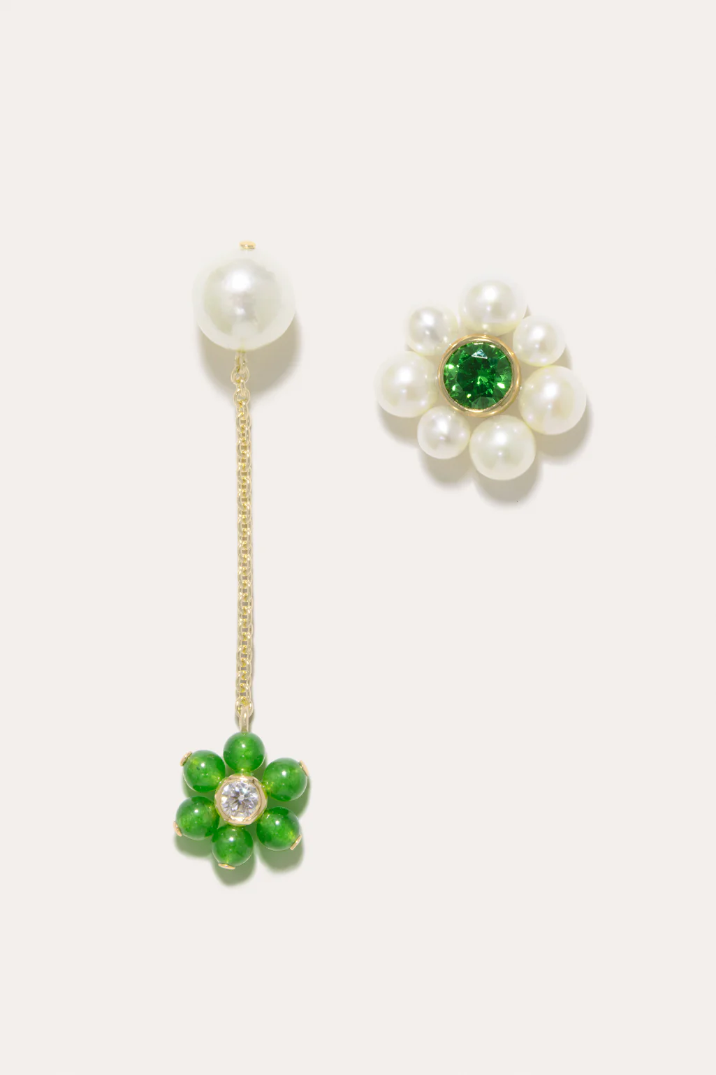 Completedworks recycled gold earrings with delicate pearl, zirconia, and jade accents, blending elegance and sustainability.
