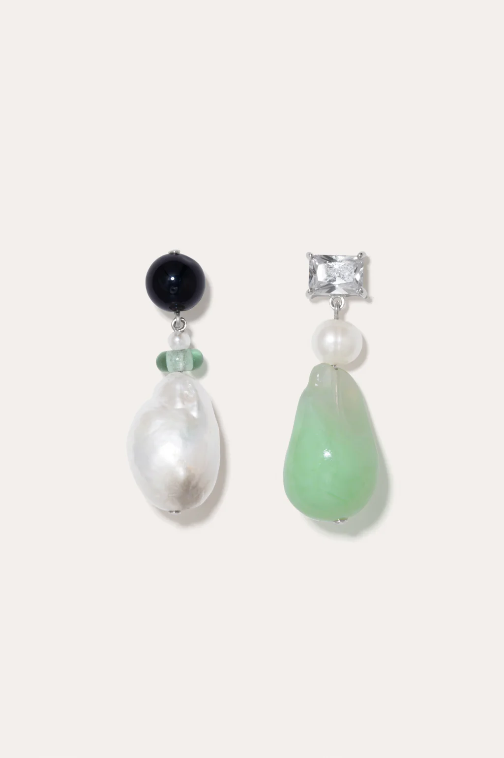 Completedworks earrings made from recycled sterling silver, with a mix of onyx, jade bio-resin, and zirconia accents.