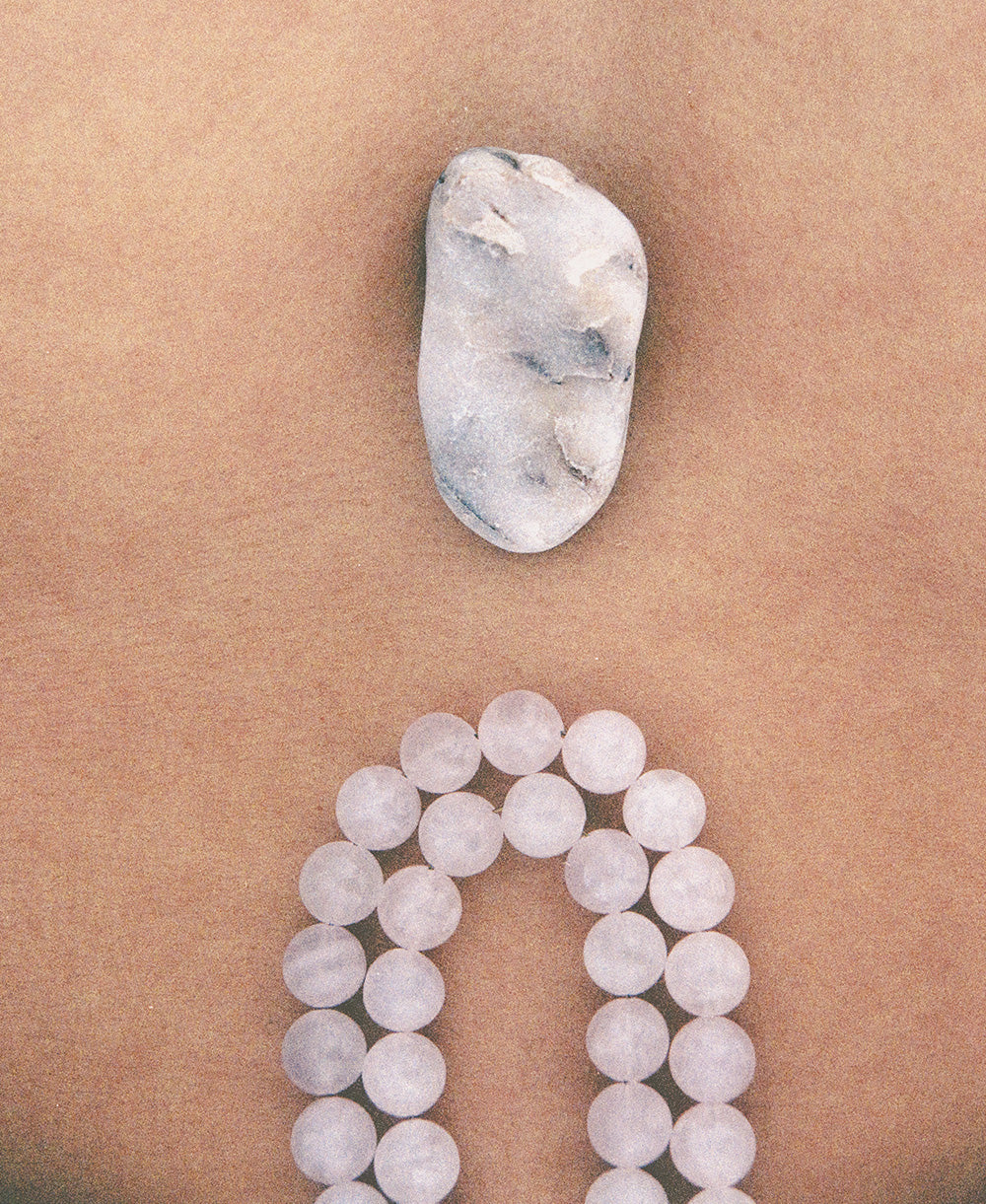 Adjustable Petra swimwear straps featuring pink quartz, inspired by the warm pink hues of stone walls