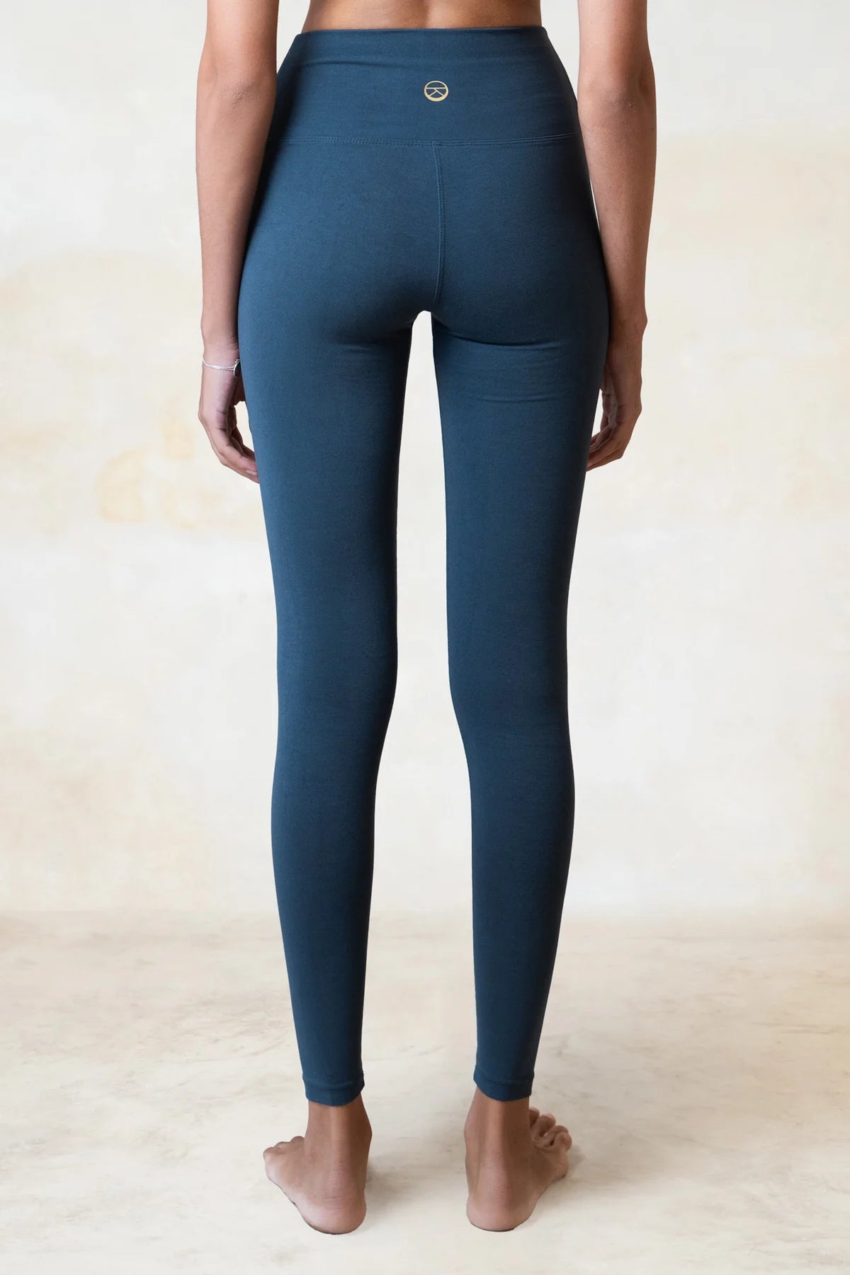 Eco-friendly blue leggings made from organic bamboo, designed for yoga and movement.