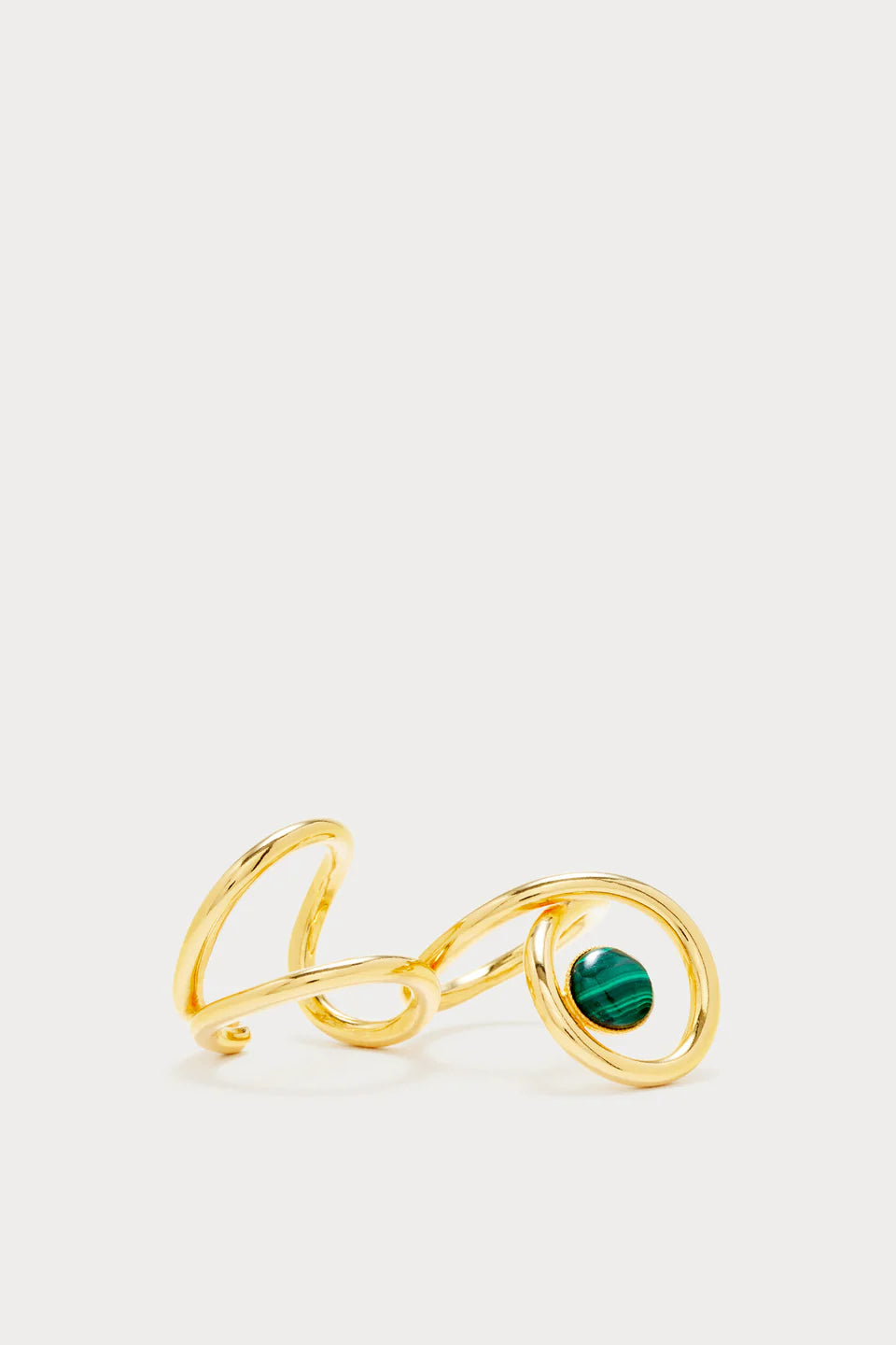 Gold plated double ring with interlocking bands and green stone worn on two fingers
