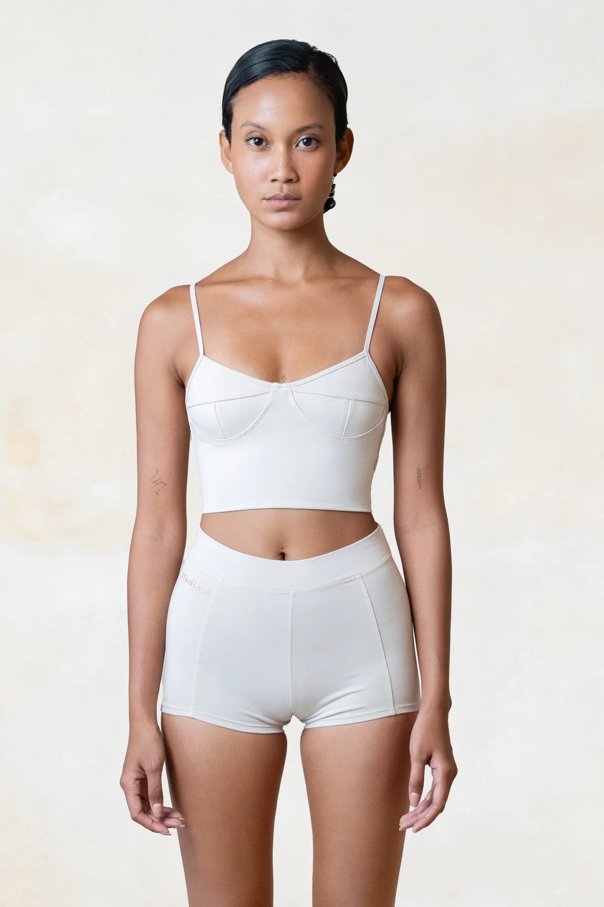 Organic bamboo white yoga crop top for women, ethical and sustainable activewear designed for comfort and movement.