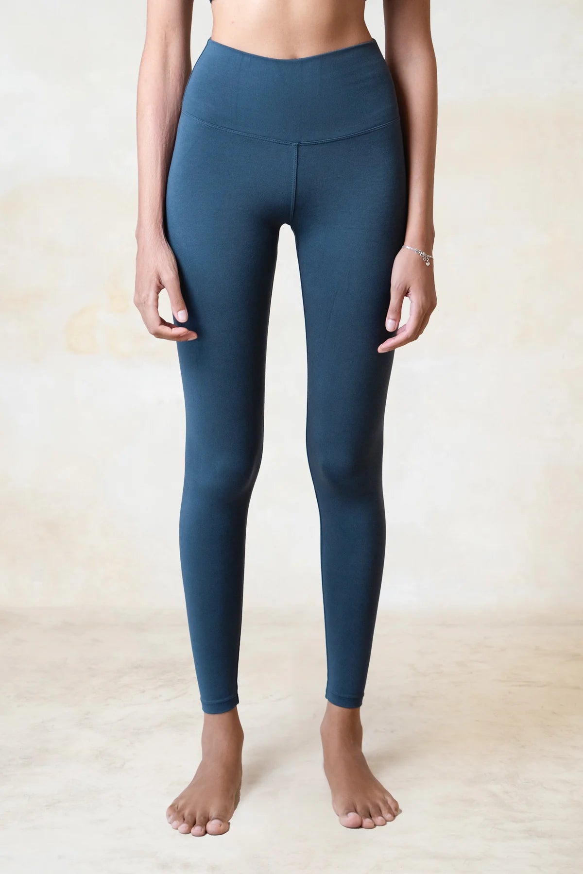 Sustainable blue yoga leggings crafted from organic bamboo for everyday practice.