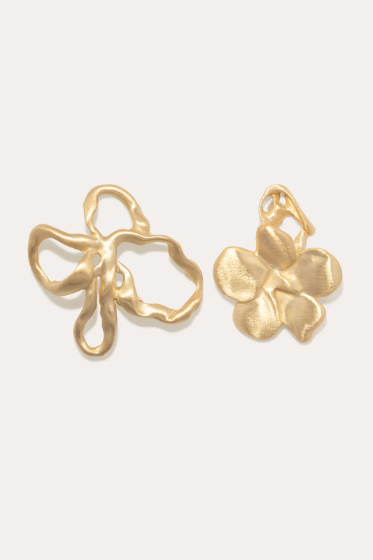 Completedworks mismatched gold-plated earrings with sculptural flower shapes, adding sophistication and style.