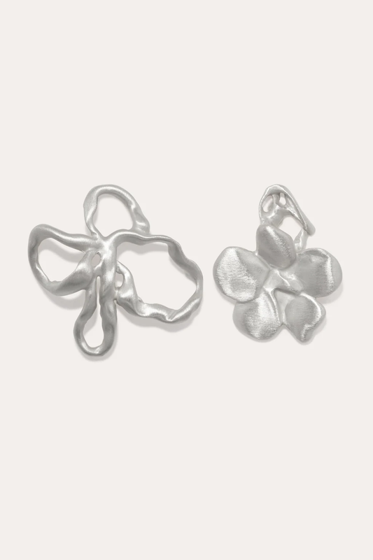 Elegant mismatched floral earrings by Completedworks, secured with a post and butterfly back.