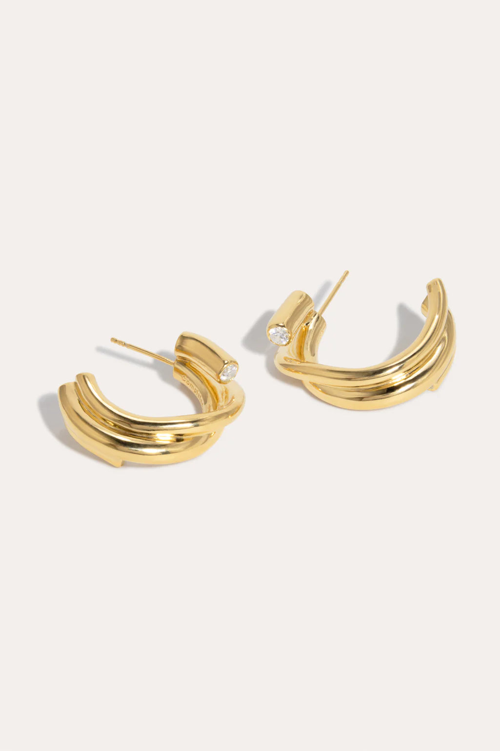 Gold and zirconia earrings - Completedworks