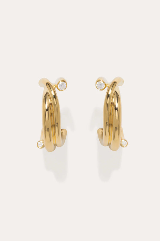 Gold and zirconia earrings - Completedworks